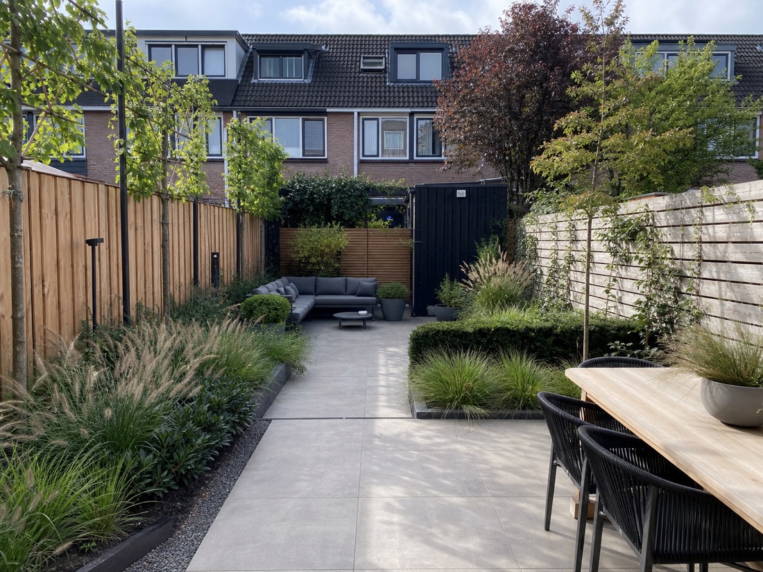 Modern garden inspiration with a terrace, green borders and a lounge area